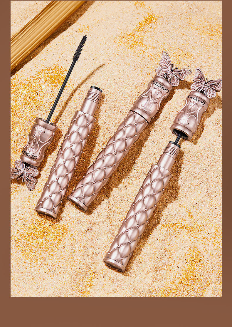 CECOMO Fluttering Butterflies Volumizing Mascara: Lengthens and curls lashes, smudge-proof, sweat-resistant, and long-lasting. Features a fine comb to coat and set lashes.
